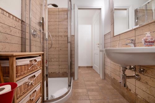 a bathroom with a sink and a shower at Villa Alessandra in Pellio Inferiore