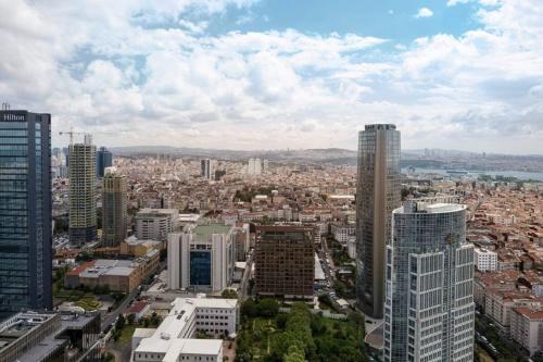 an aerial view of a city with tall buildings at Lovely Modern 1bd Condo Views W Poolgym! #222 in Istanbul