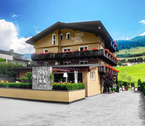 a building with a sign in front of it at Haus Bergkastelblick in Nauders
