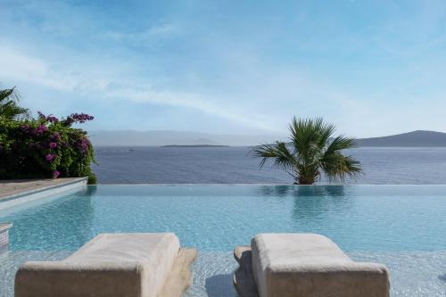 a swimming pool with a view of the ocean at Swissôtel Living Bodrum in Bodrum City