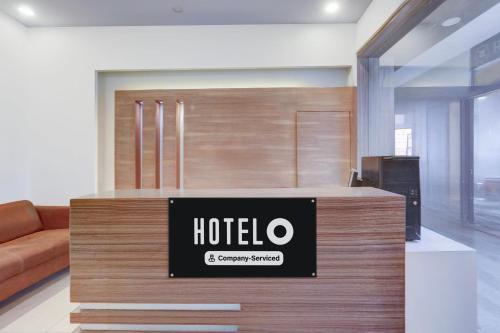 a hotel sign on a counter in a room at Super Hotel O Haldwani Near Bus Stand in Haldwāni