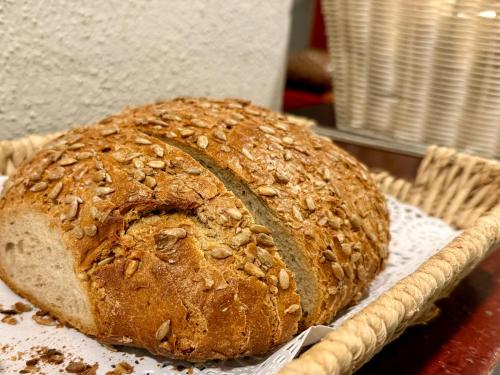 a loaf of bread sitting on top of a basket at THE 4YOU Hostel & Hotel Munich in Munich
