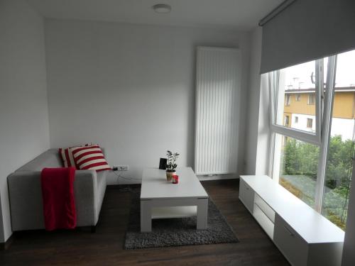 a living room with a couch and a coffee table at Cube Apartamenty in Lublin