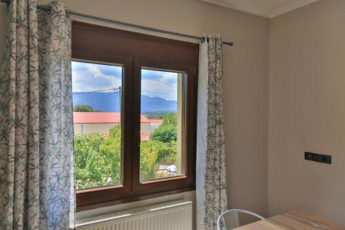 a window in a room with a view at Spacious Modern Home in Kalpaki in Kalpákion