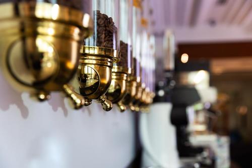 a row of gold lights hanging on a wall at Wyndham Residences The Palm in Dubai