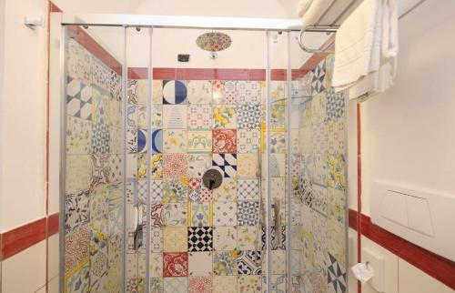 a bathroom with a shower with mosaic tiles at Hotel Villa Annalara charme and Relax in Amalfi