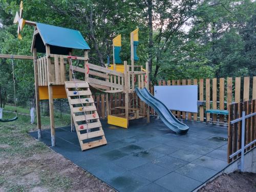 a playground with a slide and a slideintend at TETRA Plus 569 in Breaza