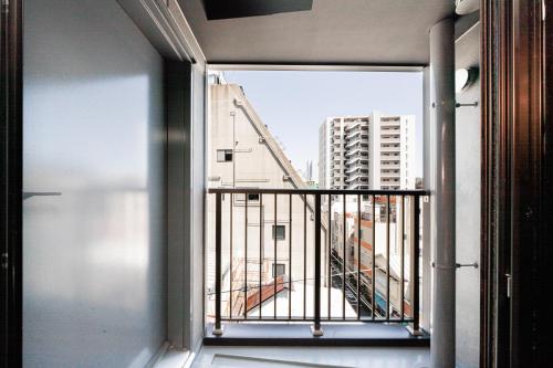 a balcony with a view of a building at FL Hotel Asakusa in Tokyo