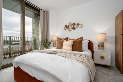 Ένα ή περισσότερα κρεβάτια σε δωμάτιο στο Cottonopolis Suite