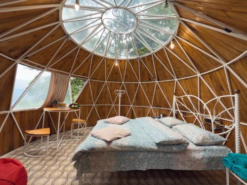 Voodi või voodid majutusasutuse Kanach Tun Boutique Hotel toas