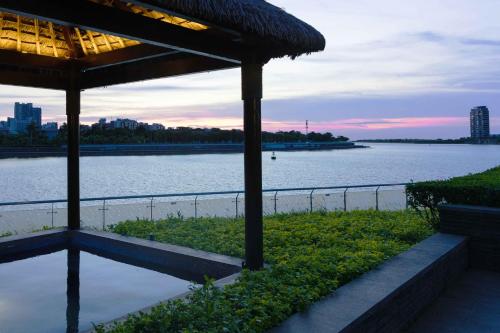 a view of a body of water with a building at Pullman Haikou in Haikou