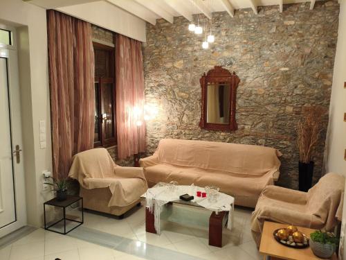 a living room with a couch and a table at V House Cozy & Quiet Escape in Mytilene