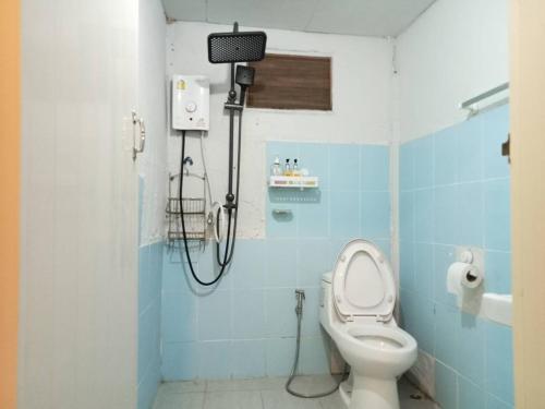 a bathroom with a shower with a toilet in it at Ingna Resort in Chanuman