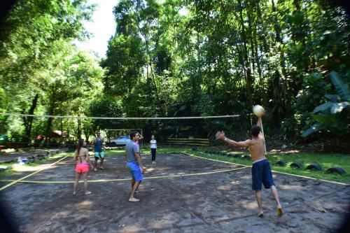 a group of people playing volleyball on a net at Recreo Verde Hot Springs & Spa in Marsella
