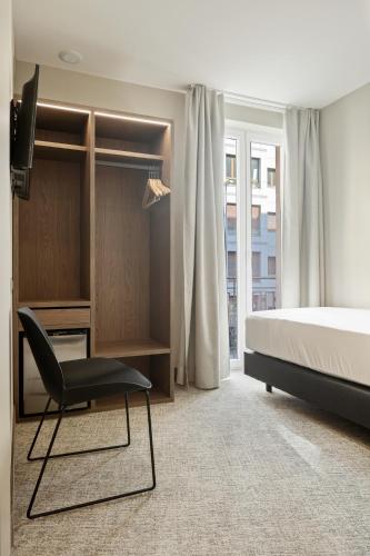Postel nebo postele na pokoji v ubytování Hotel Avenida