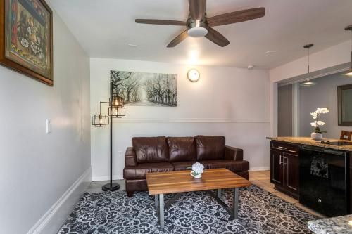 a living room with a couch and a table at Modern 4BR Elegant Living - Downtown NOLA in New Orleans