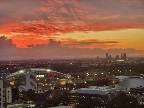 a view of a city with a sunset at Luxury Sky Escape in Sydney Olympic Park in Sydney