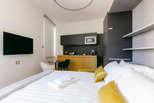 Postel nebo postele na pokoji v ubytování Villa Turco Berti luxury apartments & SPA