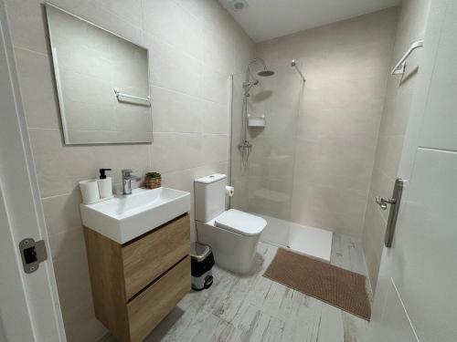 Ένα μπάνιο στο Apartahotel Bella Aurora