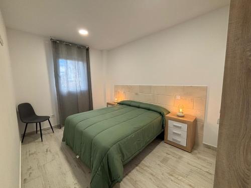 Ένα ή περισσότερα κρεβάτια σε δωμάτιο στο Apartahotel Bella Aurora