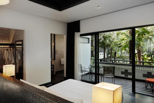 a room with a view of a balcony at Shinta Mani Angkor in Siem Reap