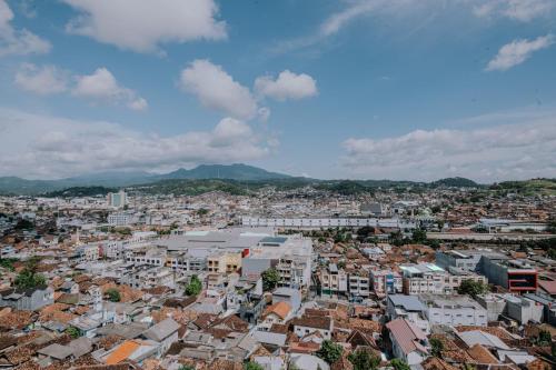 an aerial view of a city with buildings at Holiday Inn Lampung Bukit Randu by IHG in Bandar Lampung