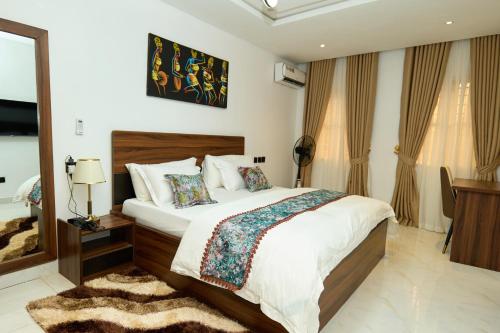 Katil atau katil-katil dalam bilik di Oasis Suites Guzape