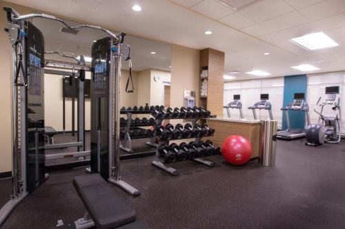 a gym with a red exercise ball and weights at TownePlace Suites by Marriott Pittsburgh Cranberry Township in Cranberry Township