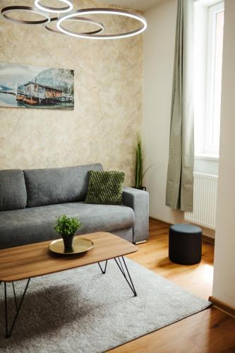a living room with a couch and a coffee table at Apartmány J&J in Šumperk