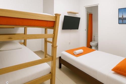 Postel nebo postele na pokoji v ubytování Hostal Mi Casita