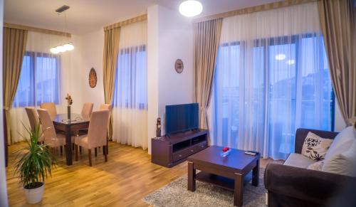 a living room with a couch and a table at Luxury Budva Center Apartments in Budva