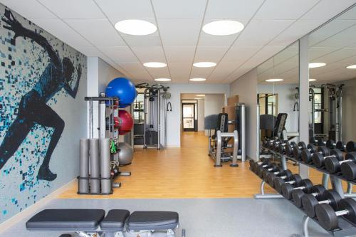 a gym with chairs and a painting on the wall at Portland Sheraton at Sable Oaks in South Portland