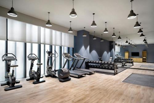 a gym with treadmills and elliptical machines at Four Points by Sheraton Josun, Seoul Myeongdong in Seoul