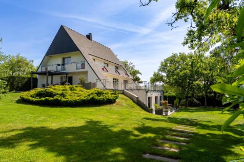a large house with a large yard at Kerwall - Maison d'hôtes in Malville