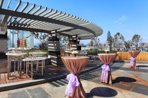 a set up for a wedding with tables and purple bows at Sheraton Wenzhou Hotel in Wenzhou