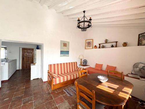 a living room with a couch and a table at La Casilla- La Almona Chica in El Chorro