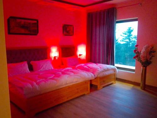 Ένα ή περισσότερα κρεβάτια σε δωμάτιο στο Snow valley hotel and restaurant