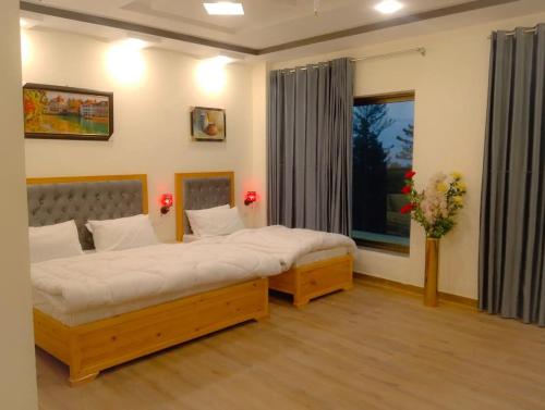 Ένα ή περισσότερα κρεβάτια σε δωμάτιο στο Snow valley hotel and restaurant