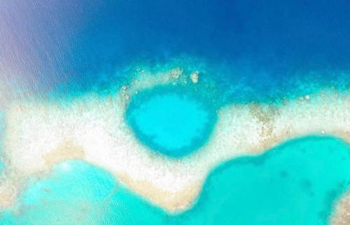 an aerial view of an island in the ocean at Rihiveli inn 