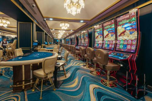 a casino with a bunch of slot machines at Chamada Girne Hotel Spa and Casino in Kérynia