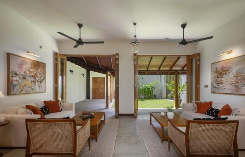 a living room with couches and a table at Granny's House in Colombo