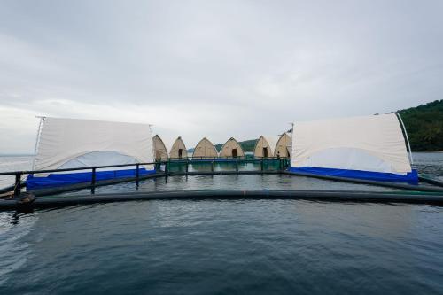 a boat with nets on top of the water at Reef Resort - Samal Island View Unit B9 in Kaputian