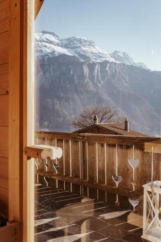 a balcony with a view of a mountain at Hidden Retreats The Signature in Brienzwiler