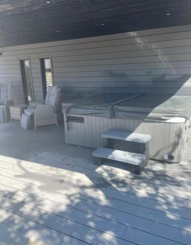 a rendering of a house with stairs and a porch at Nordic Nest in Llandowror