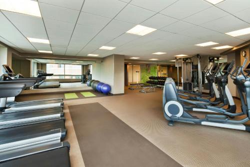 a gym with treadmills and cardio machines at The Westin Arlington in Arlington