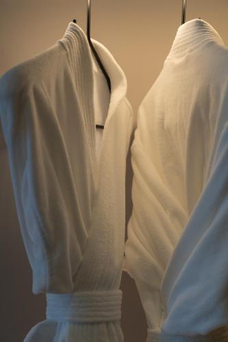 a white dress on a hanger next to a pillow at Holiday Inn Express Lijiang Ancient Town by IHG in Lijiang