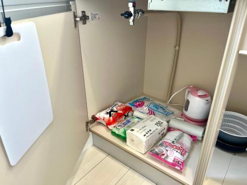 a small refrigerator with food and toiletries in it at とすアジュール in Tosu