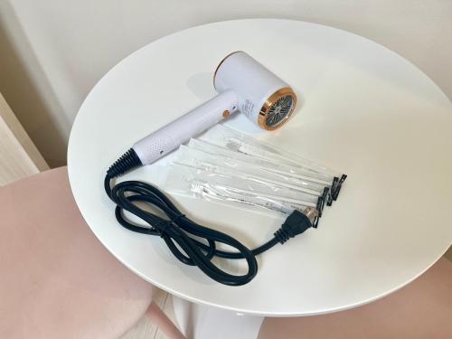 a white table with a blow dryer on it at とすアジュール in Tosu