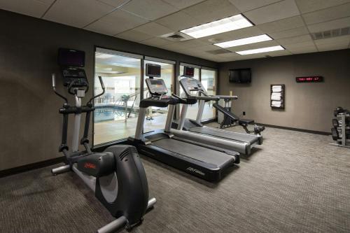 a gym with treadmills and ellipticals in a room at Courtyard by Marriott Rock Hill in Rock Hill