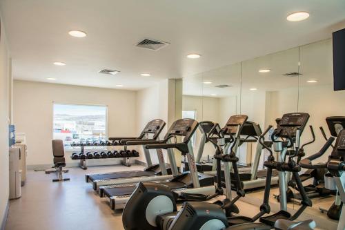 a gym with rows of treadmills and exercise bikes at Fairfield Inn & Suites Queretaro Juriquilla in Querétaro
